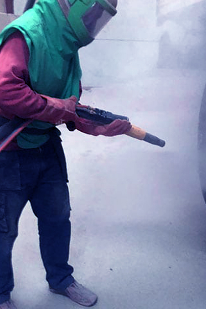 Abrasive blasting on a steel structure